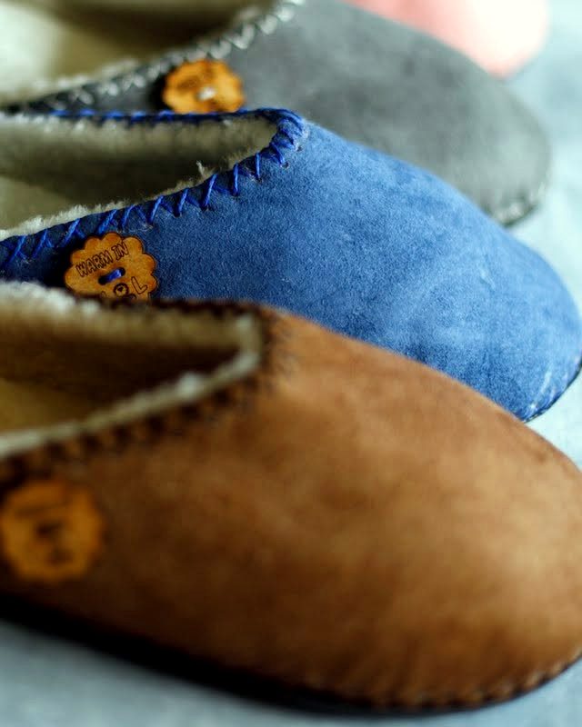 Blue and brown slip-ons with wooden buttons